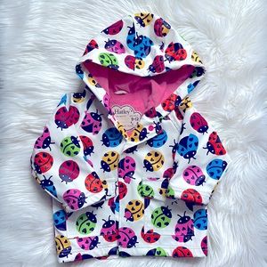 Hatley rain jacket with lady bug print and terry cloth lining.